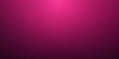 The primary subject of the image is a pink background. The setting is a dark room, and the visual style appears to be a photo. The dominant colors are pink, and the overall atmosphere is warm and inviting.