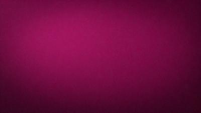 The primary subject of the image is a large, pink wall. The setting is a room with a pink background, and the visual style is a close-up of the wall. The dominant colors in the image are pink, and the overall atmosphere is warm and inviting.