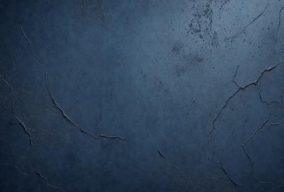 The primary subject of the image is a blue wall with a textured surface. The setting is a room with a blue wall, and the visual style is a close-up of the wall. The dominant colors are blue and grey, creating a calm and serene atmosphere.