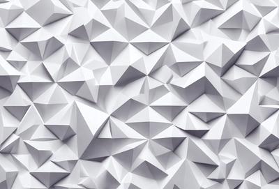 The primary subject of the image is a large white wall with a pattern of white triangles. The setting is a white room, and the visual style is a close-up of the wall. The dominant colors are white, and the overall atmosphere is clean and minimalistic.