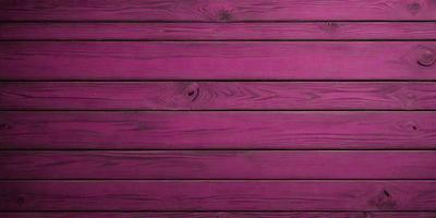 The primary subject of the image is a wooden wall with a purple hue. The setting is a room with a wooden surface, and the visual style appears to be a photo. The dominant colors are purple and brown, creating a warm and inviting atmosphere.