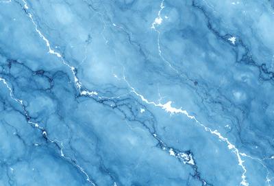 The primary subject of the image is a blue marble wall with a pattern of white streaks. The setting is a room with a blue marble floor. The visual style is a photo of the marble wall and floor. The dominant colors are blue and white, creating a calm and serene atmosphere.