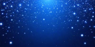 The primary subject of the image is the night sky filled with stars. The setting is a dark, star-filled background, creating a sense of depth and space. The visual style is a photo of the night sky, capturing the beauty of the stars and the vastness of the universe. The colors and mood of the image are predominantly dark, with the stars being the main source of light and creating a serene and peaceful atmosphere.