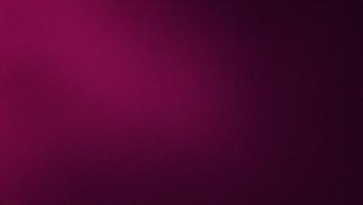 The primary subject of the image is a large, purple wall. The setting is a room with a pink background, which creates a contrasting and vibrant atmosphere. The visual style is a close-up of the wall, showcasing its color and texture. The dominant colors are purple and pink, giving the image a warm and inviting mood.