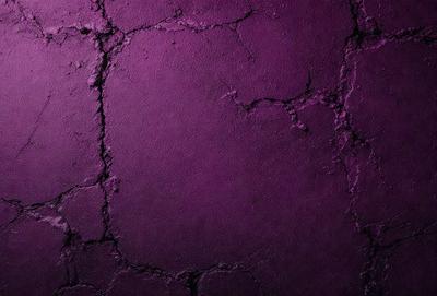 Purple wall with a hole in it.