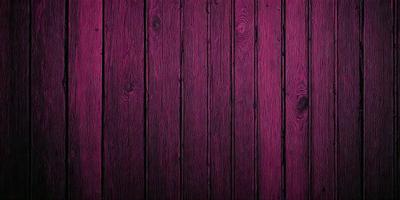 The primary subject of the image is a wooden wall with a purple color. The setting is a room with a wooden surface, and the visual style is a close-up of the wooden wall. The dominant colors are purple and brown, creating a warm and cozy atmosphere.