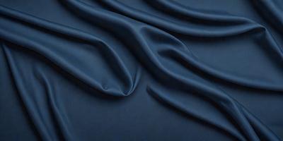 The primary subject of the image is a blue fabric, possibly a piece of cloth or a curtain. The setting is a dark background, which contrasts with the blue fabric. The visual style appears to be a close-up of the fabric, showcasing its texture and details. The colors and mood of the image are predominantly dark and moody, with the blue fabric being the main focal point.