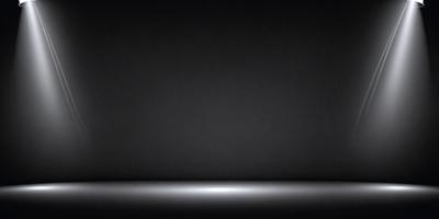 The primary subject of the image is a black background with a white light source. The setting is a dark room, and the visual style is a black and white photo. The dominant colors are black and white, creating a moody atmosphere.