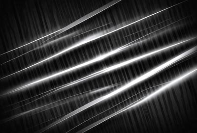 The primary subject of the image is a series of light streaks or lines, which are the main objects in the scene. The setting is a black background, which contrasts with the light streaks. The visual style appears to be a digital art or illustration, as the lines are depicted in a way that resembles a digital or computer-generated image. The colors and mood of the image are predominantly black and white, with the light streaks being the main focus and creating a sense of movement and dynamism.