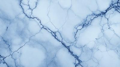 The primary subject of the image is a blue and white marbled surface, which appears to be a wall or a piece of art. The setting is a cloudy sky, which serves as the backdrop for the marbled surface. The visual style of the image is a combination of photo and digital art, creating a unique and intriguing appearance. The colors and mood of the image are predominantly blue and white, with a slightly moody atmosphere.