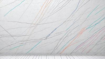 The primary subject of the image is a marble wall with a pattern of blue, orange, and green stripes. The setting is a room with a white floor, and the visual style is a close-up of the wall. The colors and mood of the image are vibrant and lively, with the blue, orange, and green stripes creating a visually striking pattern on the marble wall.