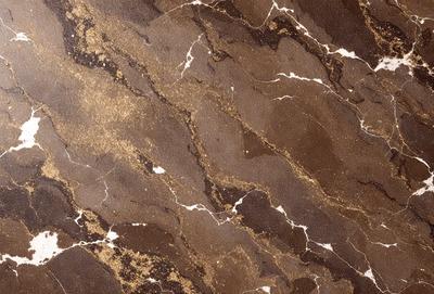 The primary subject of the image is a marble wall with a gold-colored pattern. The setting is a room with a brown and gold marble wall, which serves as the background. The visual style is a close-up of the marble wall, showcasing its intricate design. The colors and mood of the image are warm and luxurious, with the gold and brown tones creating a sense of elegance and sophistication.