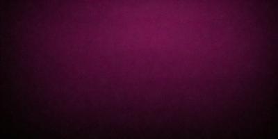 The primary subject of the image is a purple background. The setting is a dark room, and the visual style is a close-up of the purple wall. The colors and mood of the image are predominantly purple, creating a calm and serene atmosphere.