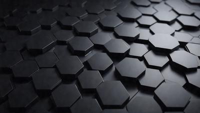 The primary subject of the image is a pattern of black and white hexagons. The setting is a black background, which creates a striking contrast with the white hexagons. The visual style is a close-up of the pattern, showcasing the intricate details of the hexagons. The colors and mood of the image are predominantly black and white, giving it a clean and modern appearance.