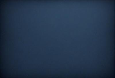 The primary subject of the image is a blue sky with no clouds. The setting is a clear, cloudless day. The visual style is a natural, outdoor scene. The colors and mood are calm and serene, as the sky is a deep shade of blue.