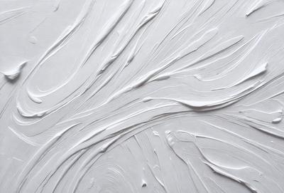 The primary subject of the image is a white, swirling, and flowing pattern on a white background. The setting appears to be a white wall, and the visual style is a combination of a photo and digital art. The dominant colors are white, and the overall atmosphere is clean, minimalistic, and artistic.