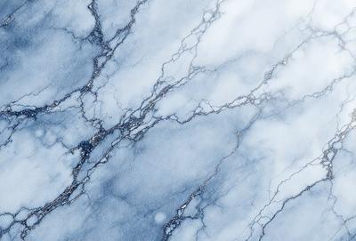 The primary subject of the image is a marble countertop with a blue and white color scheme. The setting is a kitchen or bathroom, as the countertop is a part of a counter. The visual style is a close-up of the marble countertop, showcasing its intricate patterns and textures. The colors and mood of the image are serene and elegant, with the blue and white color palette creating a sense of calmness and sophistication.