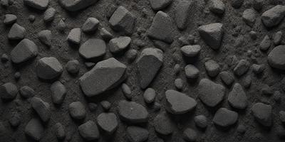 The primary subject of the image is a large rock wall with various sizes of rocks on it. The setting is a dark, possibly underground environment. The visual style is a black and white photo, giving the image a classic and timeless appearance. The dominant colors are shades of gray, black, and white, creating a moody and dramatic atmosphere.