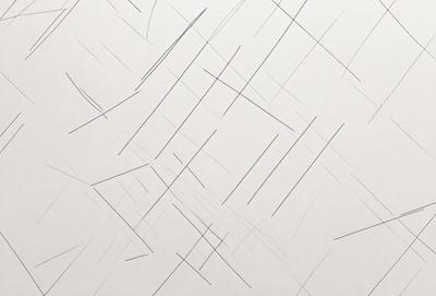 The primary subject of the image is a white wall with a pattern of black lines on it. The setting is a room with a white background. The visual style is a combination of a photo and a drawing, creating a unique and artistic appearance. The dominant colors are black and white, giving the image a clean and minimalist feel.