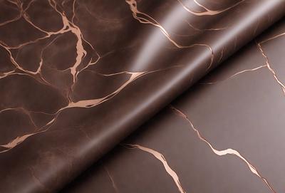 The primary subject of the image is a piece of brown leather, possibly a leather tablecloth or a leather-like material. The setting is a room with a leather-like tablecloth or material on a table. The visual style is a close-up of the leather material, showcasing its texture and appearance. The colors and mood of the image are predominantly brown, giving it a warm and natural feel.