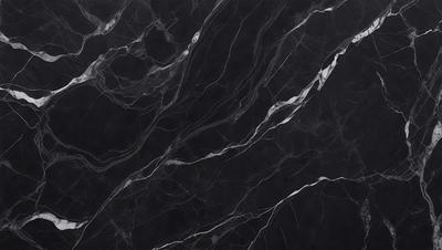 The primary subject of the image is a black marble countertop. The setting is a kitchen, with the countertop being the main focus of the scene. The visual style is a close-up of the marble countertop, showcasing its texture and pattern. The colors and mood of the image are predominantly dark, with the black marble countertop being the main source of contrast.