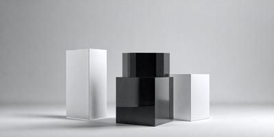 The primary subject of the image is a black square box, which is placed on a white surface. The setting is a white background, and the visual style appears to be a photo. The black box stands out against the white background, creating a contrasting and striking visual effect. The overall atmosphere of the image is minimalistic and modern.