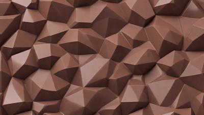 The image features a large, intricate, and textured wall made of brown paper. The wall is covered with a pattern of triangles, giving it a unique and artistic appearance. The paper appears to be a combination of brown and tan colors, creating a warm and earthy tone. The overall atmosphere of the image is one of creativity and craftsmanship, showcasing the artist's skill in designing and constructing such a visually appealing piece of art.