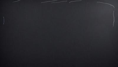 The primary subject of the image is a black background with white writing. The setting is a black surface, and the visual style appears to be a combination of a photo and digital art. The colors are predominantly black and white, creating a stark and minimalist atmosphere.