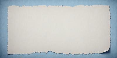 The primary subject of the image is a piece of paper with a blue background. The paper appears to be torn or damaged, giving it a worn and aged appearance. The setting is a table, and the visual style is a close-up of the paper. The colors and mood of the image are predominantly blue, creating a calm and serene atmosphere.