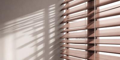 The primary subject of the image is a wooden shutter with blinds, which is located on a wall. The setting is a room with a white wall, and the visual style is a photo. The colors and mood of the image are predominantly brown, giving it a warm and natural atmosphere.