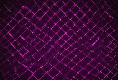 The primary subject of the image is a purple mesh pattern. The setting is a purple background, which creates a visually striking contrast with the mesh pattern. The visual style is a digital art or illustration, as the mesh pattern appears to be a digital creation. The dominant colors are purple and pink, giving the image a vibrant and lively atmosphere.