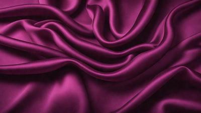 The primary subject of the image is a purple fabric, which is the main object, scene, or focus of the image. The setting or background is a purple cloth, and the visual style is a photo. The colors and mood of the image are predominantly purple, creating a calm and serene atmosphere.