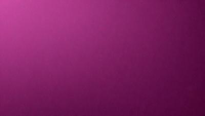 The primary subject of the image is a large, purple wall. The setting is a room with a purple background, and the visual style is a close-up of the wall. The colors and mood of the image are predominantly purple, creating a calm and serene atmosphere.