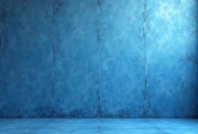 The primary subject of the image is a blue wall with a textured surface. The setting is a room with a blue wall, and the visual style is a photo. The dominant colors are blue and white, creating a calm and serene atmosphere.