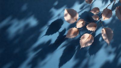 The primary subject of the image is a leaf, which is the main object, scene, or focus of the image. The leaf is placed on a blue surface, which serves as the setting or background. The visual style of the image is a photo, capturing the leaf in its natural environment. The colors and mood of the image are predominantly blue, creating a calm and serene atmosphere.