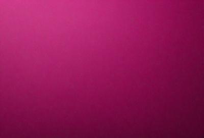 The primary subject of the image is a large, pink wall. The setting is a room with a pink background, and the visual style is a close-up of the wall. The dominant colors in the image are pink, and the overall atmosphere is warm and inviting.