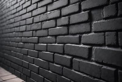 The primary subject of the image is a black brick wall. The setting is a dark room, and the visual style is a close-up of the brick wall. The dominant colors are black and grey, creating a moody atmosphere.