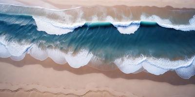 The primary subject of the image is a large wave crashing onto the beach. The setting is a sandy beach with the ocean in the background. The visual style is a photo of the beach with the wave. The dominant colors are blue and white, with the blue representing the ocean and the white representing the wave. The overall atmosphere is dynamic and energetic, as the wave is crashing onto the beach.