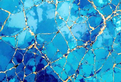 The primary subject of the image is a blue and gold patterned surface, which appears to be a piece of art or a decorative item. The setting is a blue background, which complements the blue and gold colors of the pattern. The visual style of the image is a combination of digital art and illustration, creating a unique and eye-catching design. The colors and mood of the image are predominantly blue and gold, giving it a warm and inviting atmosphere.