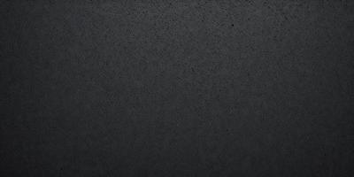 The primary subject of the image is a black background with a pattern of white dots. The setting is a dark room, and the visual style is a black and white photo. The dominant colors are black and white, creating a moody and dramatic atmosphere.