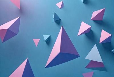 The primary subject of the image is a collection of three-dimensional geometric shapes, including triangles and pyramids, arranged on a blue background. The shapes are made of paper and are displayed in various sizes and orientations. The visual style of the image is a combination of digital art and illustration, creating a unique and eye-catching pattern. The dominant colors in the image are blue and purple, giving the scene a calm and soothing atmosphere.