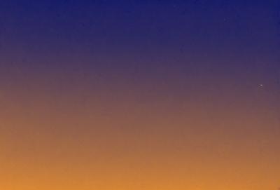 The primary subject of the image is the sky, which is a deep shade of blue. The setting is a vast, open space with no visible landmarks or objects. The visual style is a natural, outdoor scene with no indication of digital manipulation or artistic elements. The colors and mood of the image are serene and peaceful, with the deep blue sky creating a sense of calmness and tranquility.