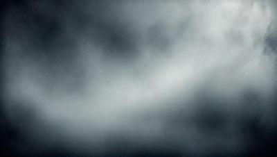 The primary subject of the image is a cloudy sky. The setting is a dark, cloudy day with a gloomy atmosphere. The visual style is a photo, capturing the natural beauty of the cloudy sky. The colors and mood are predominantly dark and moody, with the clouds being the main focus of the image.