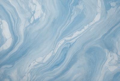 The primary subject of the image is a blue and white marbled tile. The setting is a bathroom, as indicated by the presence of the marbled tile. The visual style is a close-up of the tile, showcasing its intricate design. The dominant colors are blue and white, creating a calm and soothing atmosphere.