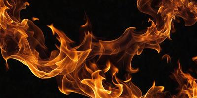 The primary subject of the image is a flame, which is the main object, scene, or focus of the image. The setting or background is a dark surface, which contrasts with the bright flame. The visual style of the image is a close-up of the flame, which emphasizes its shape and intensity. The colors and mood of the image are predominantly orange and yellow, which are associated with warmth and energy.