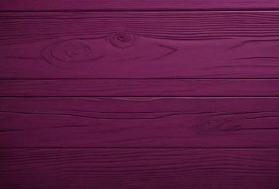 The primary subject of the image is a purple wooden wall. The setting is a room with a wooden floor. The visual style is a close-up of the wooden wall, showcasing its texture and color. The dominant colors are purple and brown, creating a warm and inviting atmosphere.