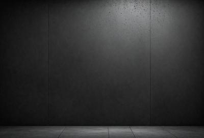 The primary subject of the image is a gray wall. The setting is a room with a gray wall, and the visual style is a photo. The colors and mood of the image are predominantly gray, creating a neutral and calm atmosphere.