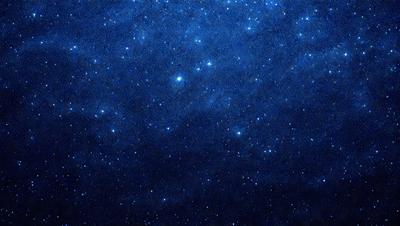 The primary subject of the image is the night sky filled with stars. The setting is a dark, cloudy night, with the stars shining brightly against the backdrop of the night sky. The visual style is a photo of the night sky, capturing the beauty of the stars and the darkness of the night. The colors and mood of the image are predominantly dark, with the stars providing a contrasting and luminous element.