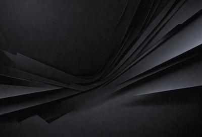 The primary subject of the image is a black and white photo of a curved, spiraling pattern. The setting is a dark background, which contrasts with the pattern. The visual style is a black and white photo, giving it a classic and timeless appearance. The colors and mood of the image are predominantly dark, with the pattern being the main focus and source of visual interest.