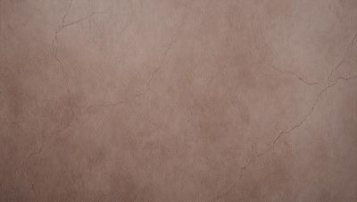 The primary subject of the image is a brown leather wall. The setting is a room with a brown leather wall, and the visual style is a close-up of the wall. The colors and mood of the image are warm and earthy, with the brown leather wall being the main focus.